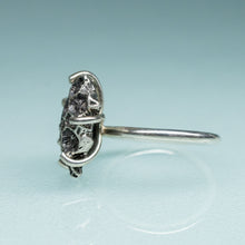 Load image into Gallery viewer, side view of northern star coral cast in oxidized recycled silver and prong set in a ring by hkm jewelry