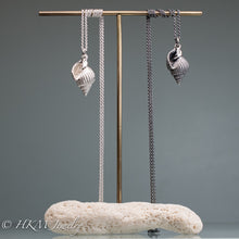 Load image into Gallery viewer, cast silver sanibel nutmeg shell necklaces on brass and coral display by hkm jewelry