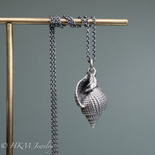 Load image into Gallery viewer, front view of close up view of cast silver nutmeg shell necklace in an oxidized finish by hkm jewelry