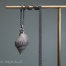 Load image into Gallery viewer, back view of cast silver nutmeg shell necklace in an oxidized finish by hkm jewelry