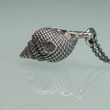 Load image into Gallery viewer, close up view of hallmark 925 and makers mark on cast silver nutmeg shell necklace in an oxidized finish by hkm jewelry