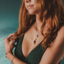 Load image into Gallery viewer, Female, red-head, kitten’s paw ring, viking rope cuff, life saver cuff, thick-lip drill necklace, queen conch necklace, green/blue, teal, underwater background