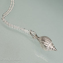 Load image into Gallery viewer, close up side view of cast silver nutmeg shell necklace in a polished finish by hkm jewelry