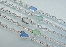 Load image into Gallery viewer, Four silver chain bracelets with sea glass charms in blue, green, and white, arranged diagonally on a light blue background.