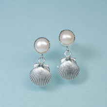 Load image into Gallery viewer, bay scallop and pearl earrings with two tier dangle on blue background