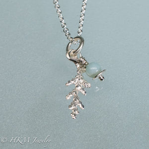 close up of cast silver cypress bough and amazonite necklace by hkm jewelry in polished finish