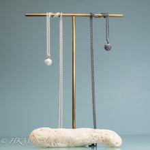 Load image into Gallery viewer, cast silver kousa dogwood fruit necklaces on brass and coral jewelry stand by hkm jewelry in polished and oxidized finish