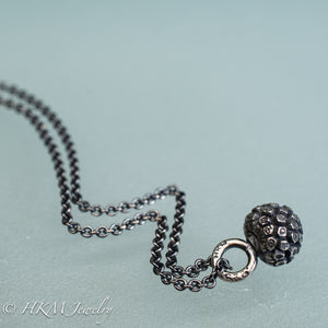 cast silver kousa dogwood fruit necklace by hkm jewelry in oxidized finish