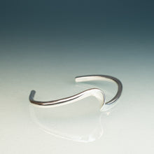 Load image into Gallery viewer, Silver bracelet on a gradient blue and gray background