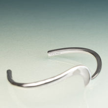 Load image into Gallery viewer, Silver bracelet on a light green background