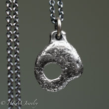 Load image into Gallery viewer, back of hag stone necklace cast in sterling silver by hkm jewelry in oxidized silver finish