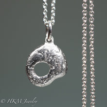 Load image into Gallery viewer, back of  hag stone necklace cast in sterling silver by hkm jewelry in polished finish