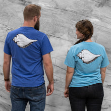 Load image into Gallery viewer, Two people wearing blue t-shirts with a shell design on the back against a gray marble wall.