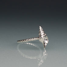 Load image into Gallery viewer, side view of silver horse conch shell ring with twisted band on gradient blue background
