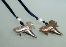 Load image into Gallery viewer, Two shark tooth ornaments on blue cords with pearls against a light gray background