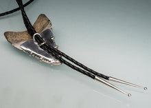 Load image into Gallery viewer, back of shark tooth bolo tie in silver and leather on green blue background