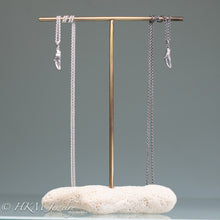 Load image into Gallery viewer, mini lady crab claw necklaces cast in recycled silver in a both polished and oxidized finishes on coral and brass jewelry stand by hkm jewelry