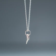 Load image into Gallery viewer, side view of small silver shark tooth necklace on cable chain with blue gradient background