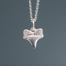 Load image into Gallery viewer, backside of small silver shark tooth necklace on cable chain with blue gradient background