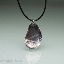 Load image into Gallery viewer, Naticidae moon snail operculum cast in sterling silver on leather cord by hkm jewelry