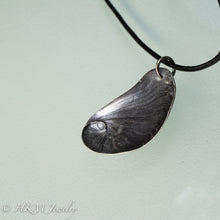 Load image into Gallery viewer, Naticidae moon snail operculum cast in sterling silver on leather cord by hkm jewelry