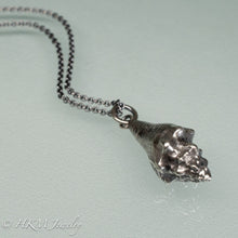 Load image into Gallery viewer, close up back view of juvenile queen conch necklace in oxidized silver by hkm jewelry