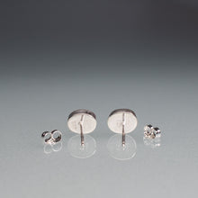 Load image into Gallery viewer, Set of silver earrings on a gray background