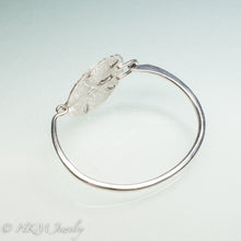 Load image into Gallery viewer, side view of molded and cast real sand dollar cuff bracelet in recycled sterling silver by hkm jewelry