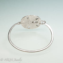 Load image into Gallery viewer, underside view of molded and cast real sand dollar cuff bracelet in recycled sterling silver by hkm jewelry
