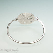 Load image into Gallery viewer, underside view of molded and cast real sand dollar cuff bracelet in recycled sterling silver by hkm jewelry