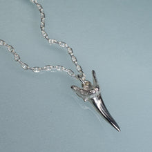 Load image into Gallery viewer, silver shark tooth necklace on anchor chain on light blue background