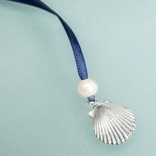 Load image into Gallery viewer, cast silver shell from cape may NJ scallop ornament with freshwater pearl and navy blue satin ribbon by hkm jewelry