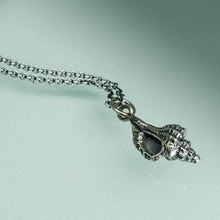 Load image into Gallery viewer, close up detail opening of thick-lipped drill snail shell necklace cast in sterling silver oxidized finish by hkm jewelry
