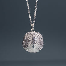 Load image into Gallery viewer, small silver sand dollar shell necklace on cable chain with grey background
