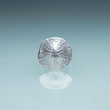 Load image into Gallery viewer, silver sand dollar ring on blue green gradient background