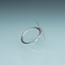 Load image into Gallery viewer, side of silver sand dollar ring on blue green gradient background