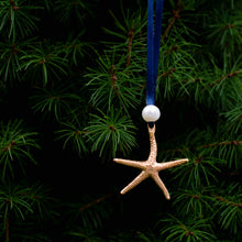 Load image into Gallery viewer, cast bronze starfish ornament with freshwater pearl and navy blue satin ribbon by hkm jewelry