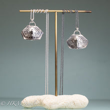 Load image into Gallery viewer, Diamondback terrapin turtle shell scute necklaces cast in silver on a brass and coral jewelry stand by hkm jewelry