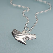 Load image into Gallery viewer, silver shark tooth necklace on anchor chain on light blue background