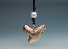Load image into Gallery viewer, Bronze pendant with a pearl on a blue cord against a gray background