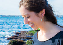 Load image into Gallery viewer, Carlye modeling the oxidized mini auger shell studs by hkm jewelry