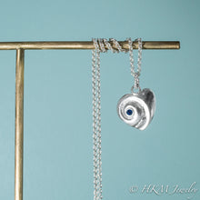 Load image into Gallery viewer, Heart of the Sea moon snail necklace by hkm jewelry with september birthstone sapphire