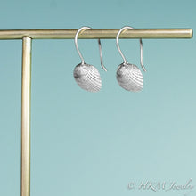 Load image into Gallery viewer, side view of the ark clam seashell dangle earrings by hkm jewelry in sterling silver