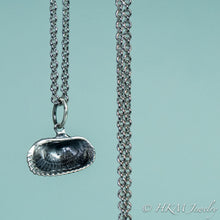 Load image into Gallery viewer, back close up view of ark clam shell necklace in oxidized silver by hkm jewelry