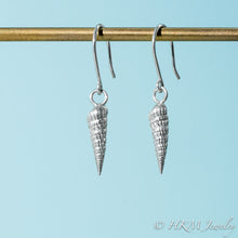 Load image into Gallery viewer, side close up view of auger snail shell dangle earrings in polished silver by hkm jewelry