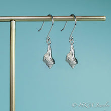 Load image into Gallery viewer, close up side view of the baby knobbed whelk dangle earrings in sterling by hkm jewelry