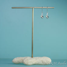 Load image into Gallery viewer, to scale view of the baby knobbed whelk dangle earrings in sterling by hkm jewelry
