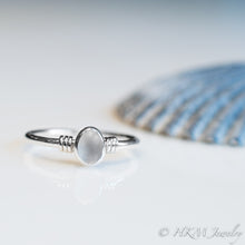 Load image into Gallery viewer, raw cape may diamond ring with knot detail featured 3 wraps of wire around the ing band on either side of the stoneby hkm jewelry
