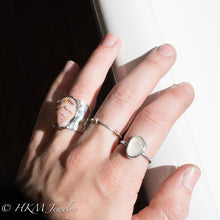 Load image into Gallery viewer, model wearing large bezel set raw cape may diamond ring in sterling silver  by HKM Jewelry
