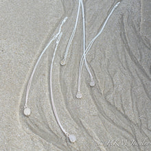 Load image into Gallery viewer, assorted raw cape may diamond necklaces by hkm jewelry laying in sand